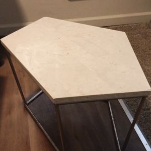 Two marble end tables eggshell color
